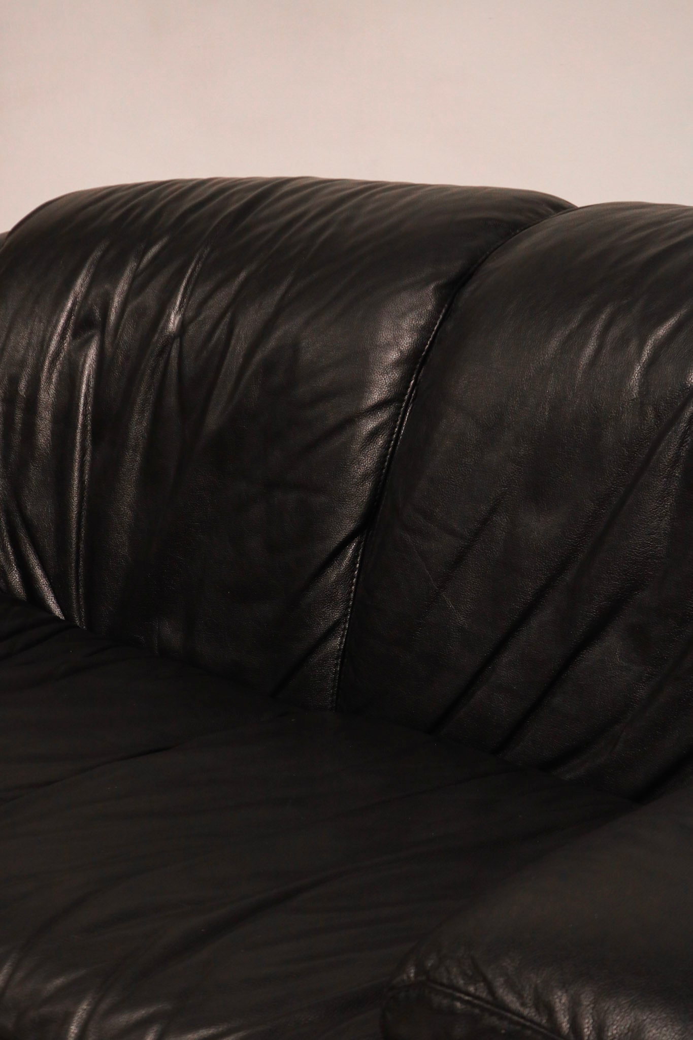 Top angled view showing thick genuine leather and comfort depth of seat