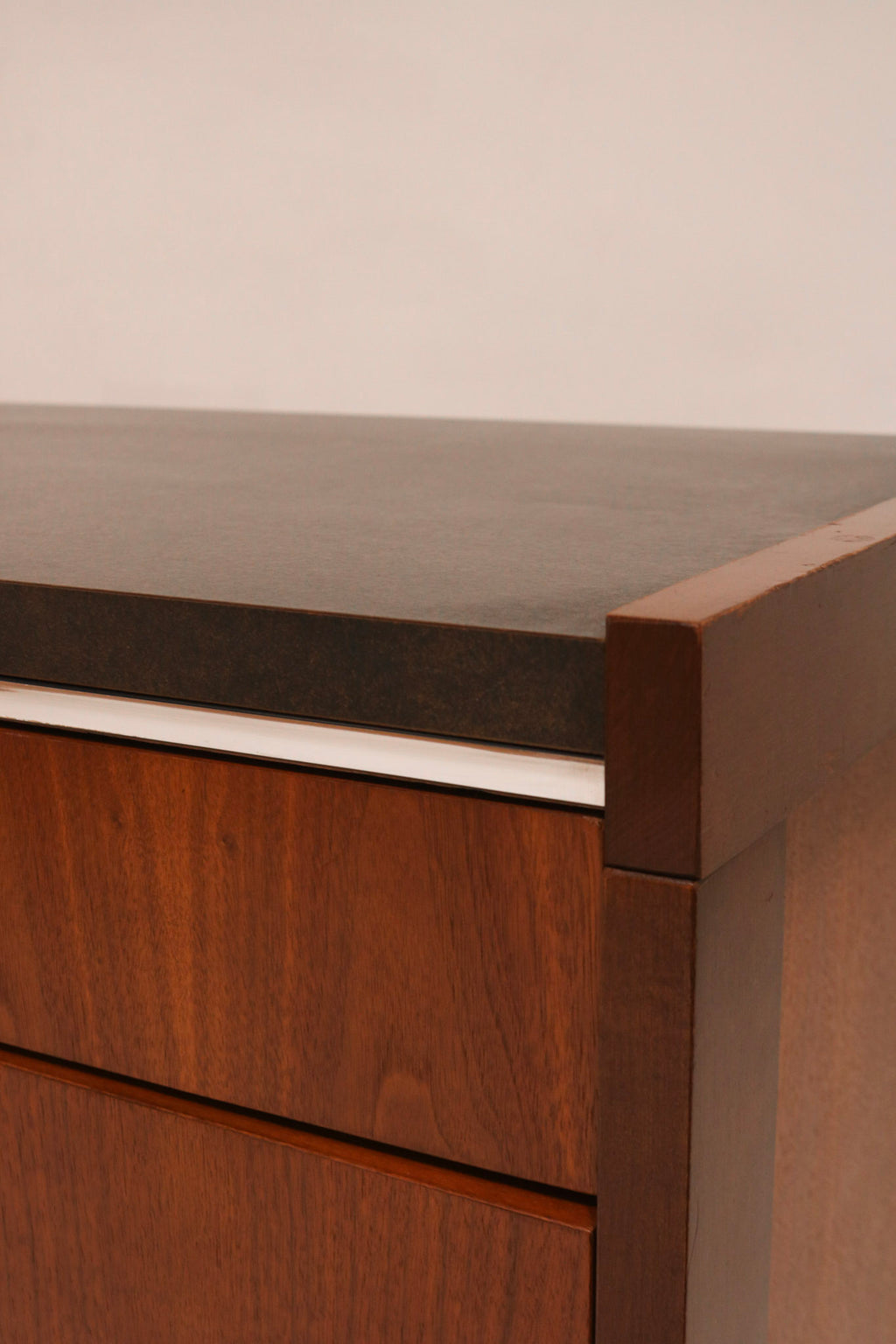 Close-up of top corner showing the junction between laminate top and wood edge