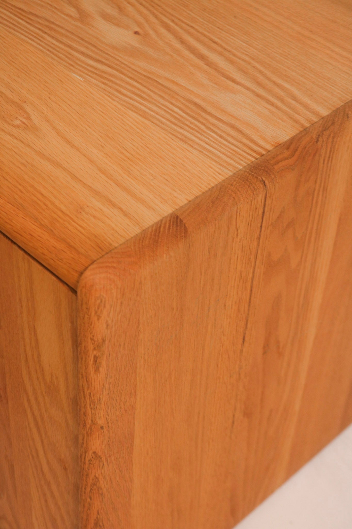 Detail of top corner finish showing solid oak construction and condition