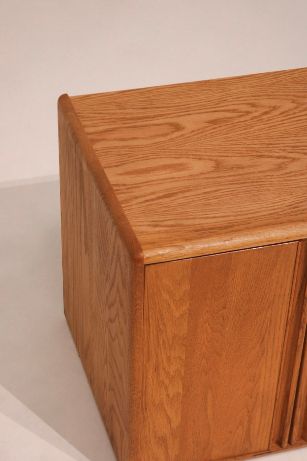 Close-up of the top corner showing solid oak grain and construction