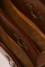 High angle view of open drawers highlighting the serpentine front shape