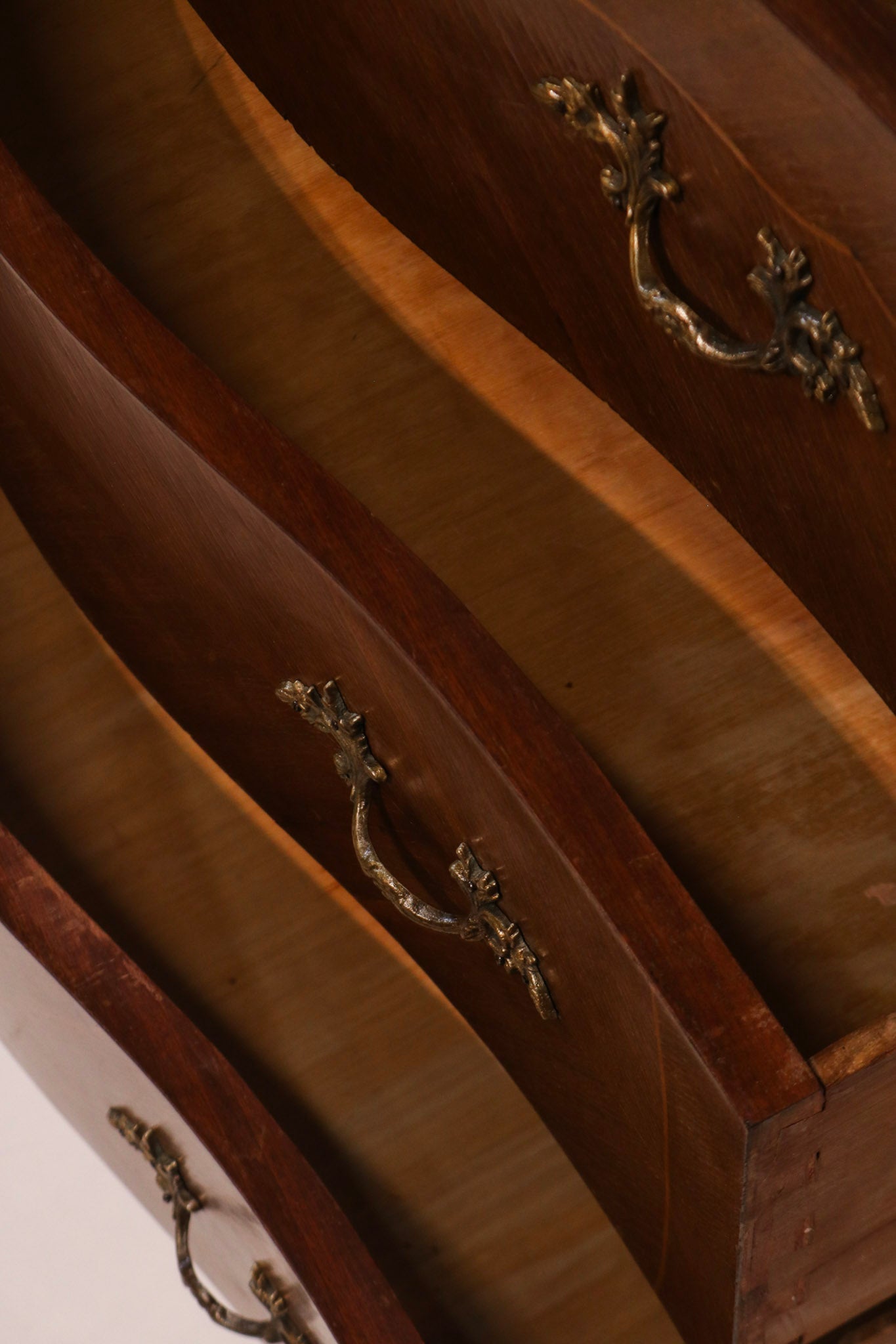 High angle view of open drawers highlighting the serpentine front shape