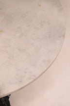 Top-down view of the circular marble table surface
