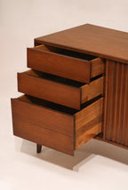Top-down view highlighting the distinctive curved front profile of the dresser