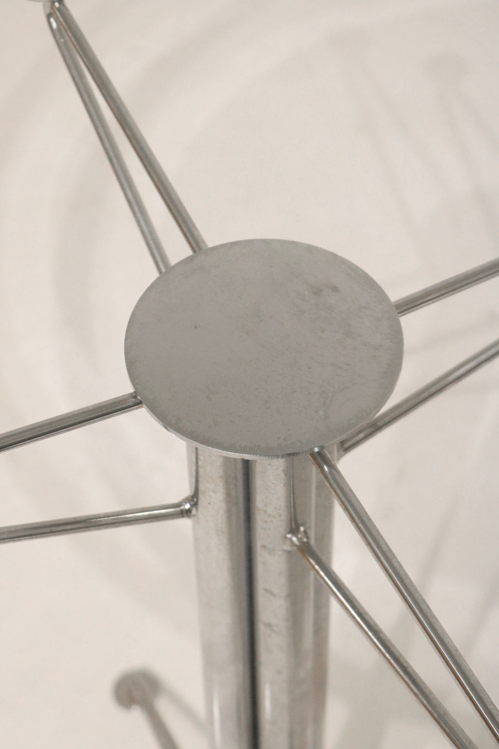 Top-down view through the glass showing the steel base connection point