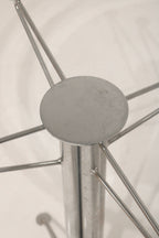 Top-down view through the glass showing the steel base connection point