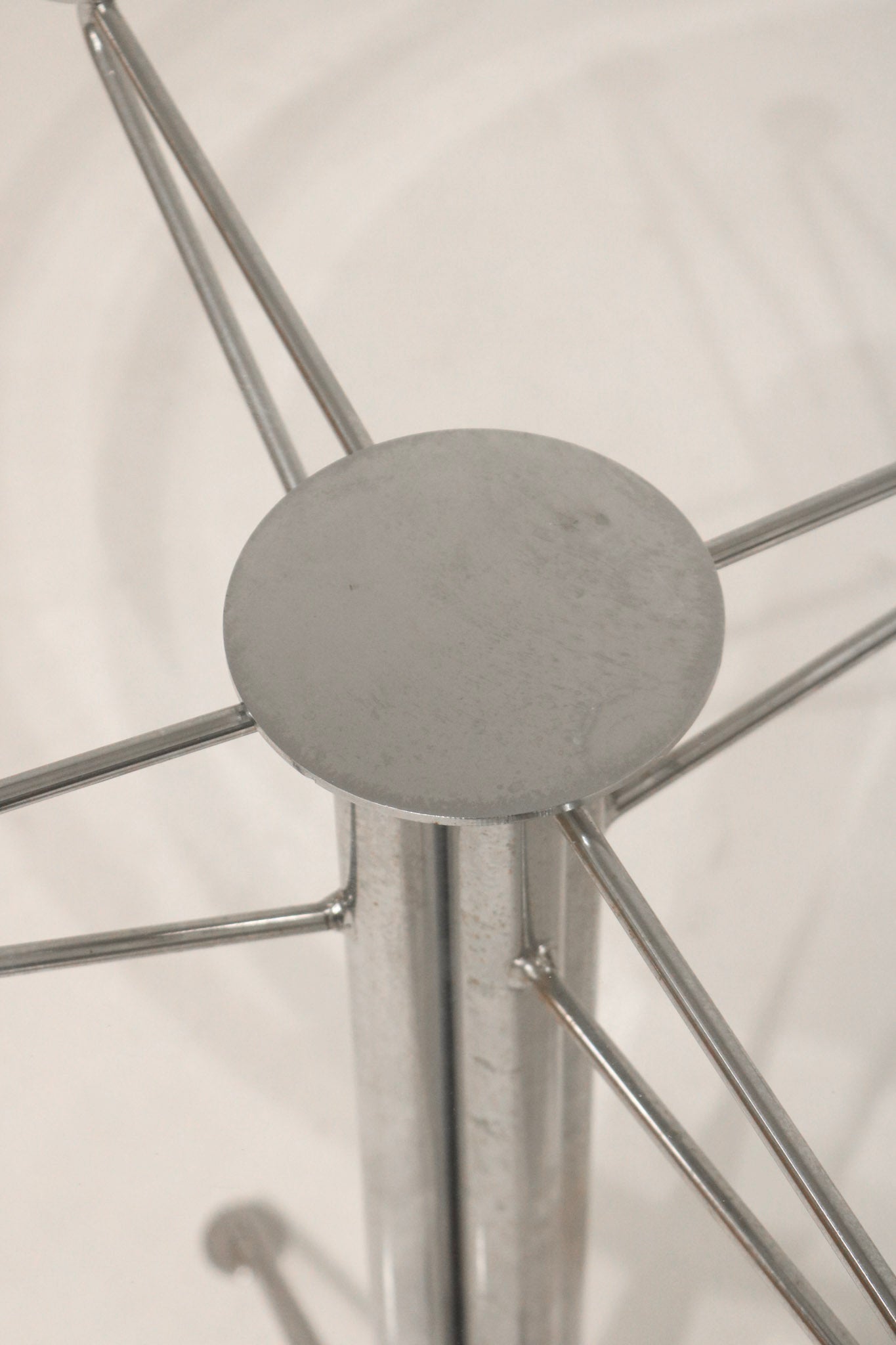 Top-down view through the glass showing the steel base connection point