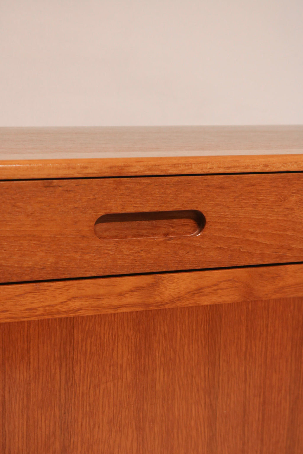 View of top drawer, possibly felt-lined for cutlery storage