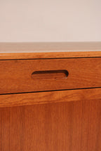 View of top drawer, possibly felt-lined for cutlery storage
