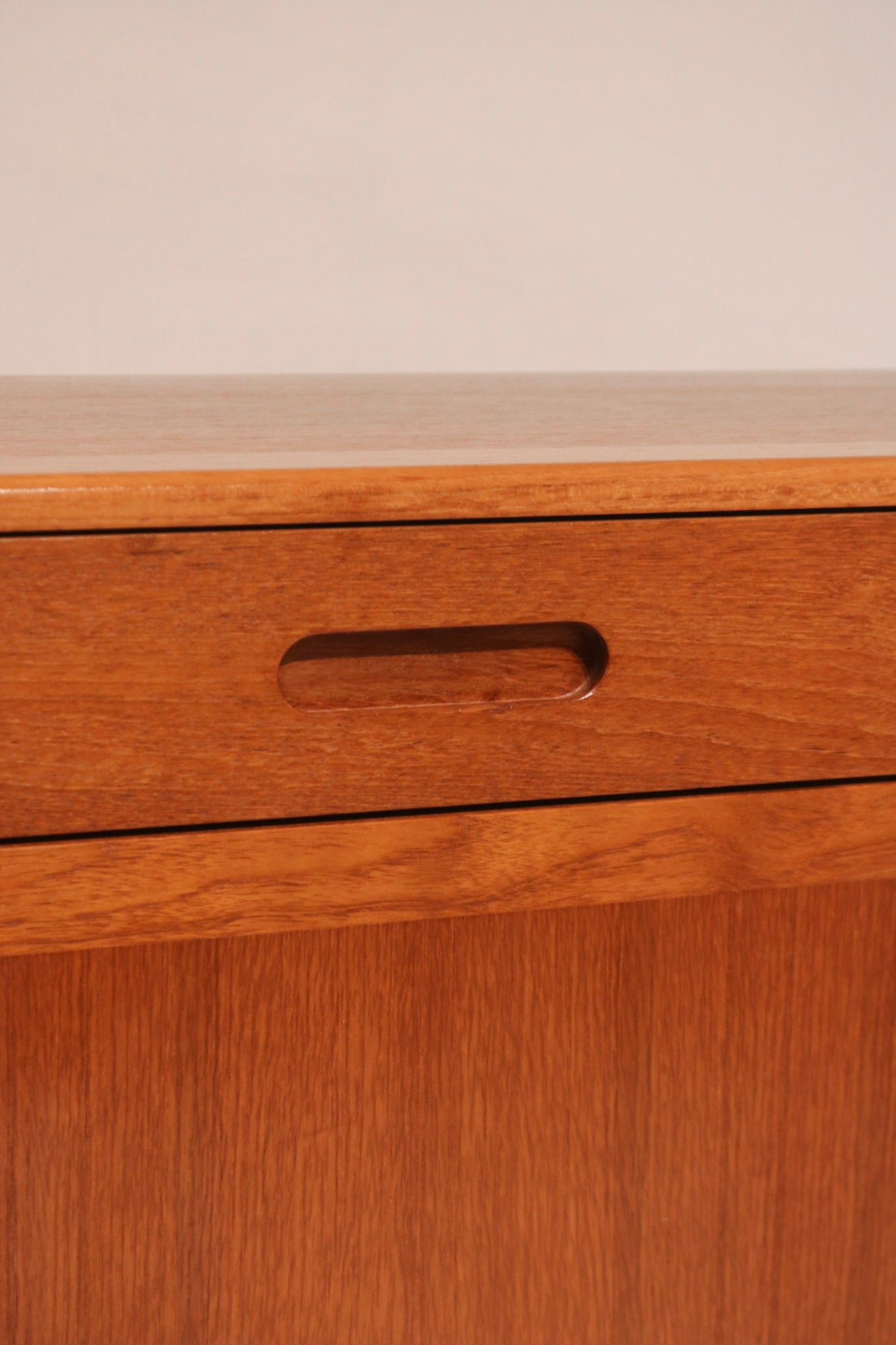 View of top drawer, possibly felt-lined for cutlery storage