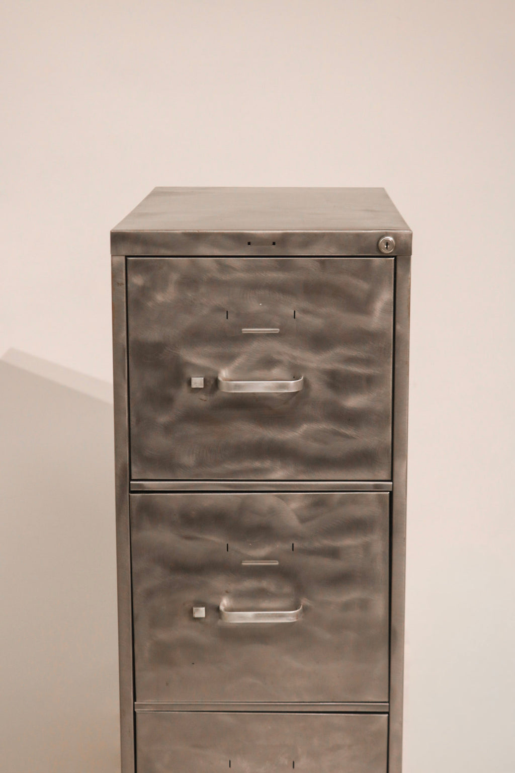 Front view of top drawer featuring label holder and handle detail
