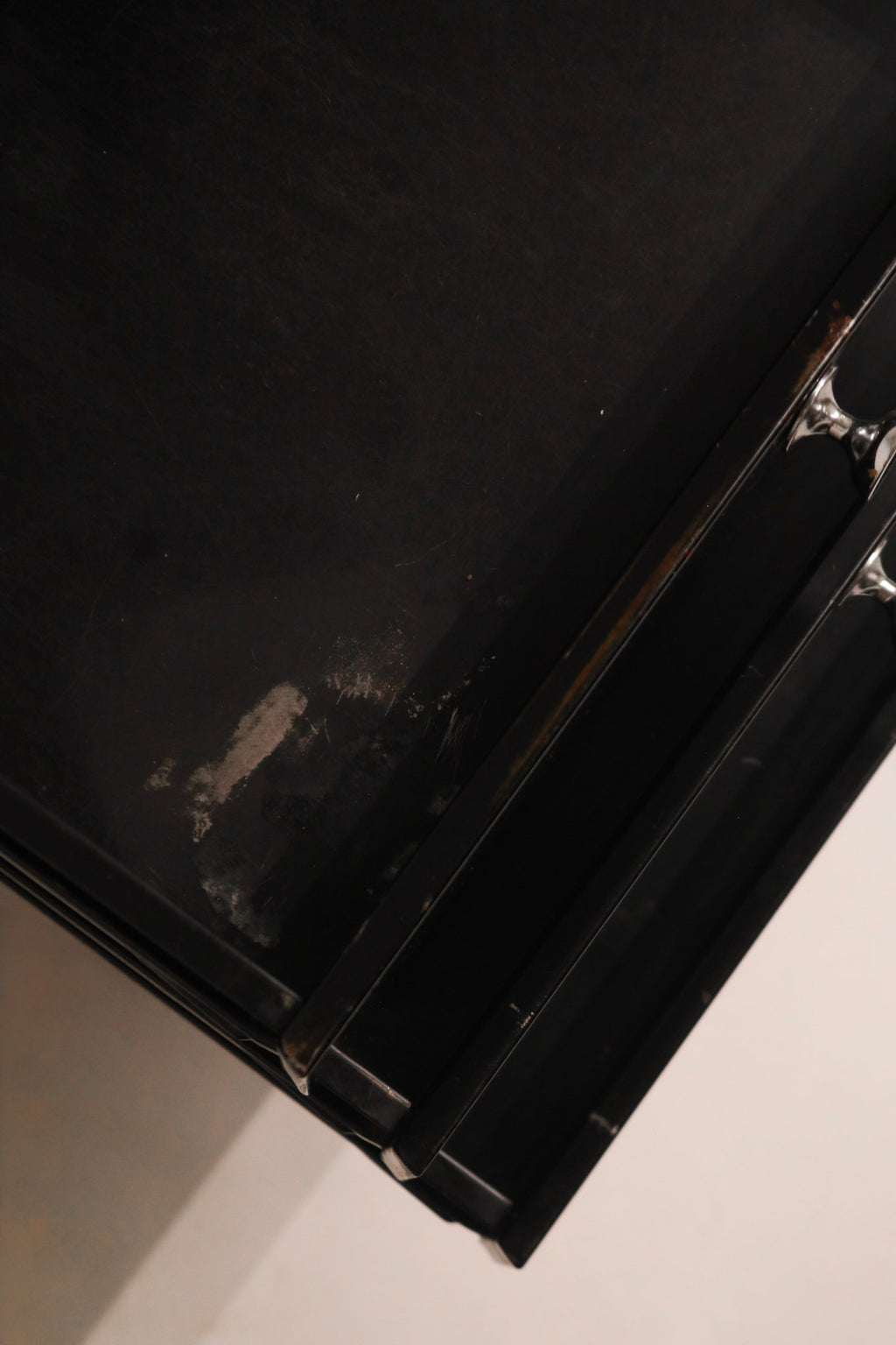 Top drawer open revealing storage compartment and steel finish