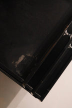 Top drawer open revealing storage compartment and steel finish