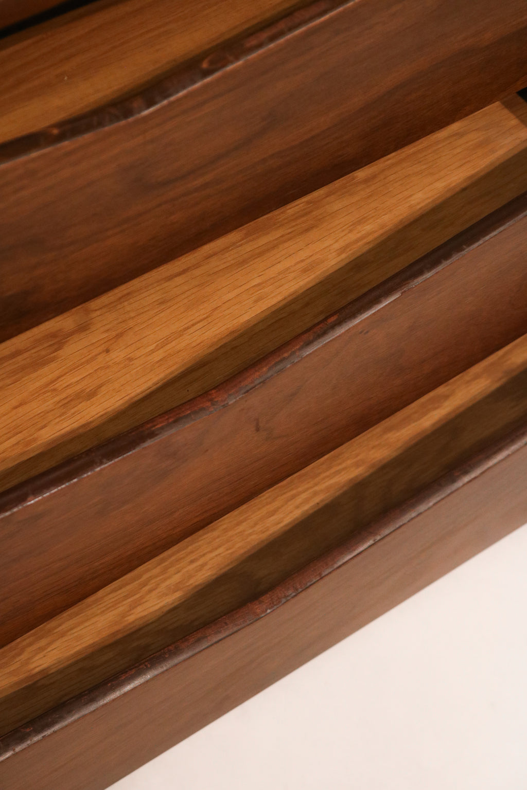 Detail of the top edge profile following the curvature of the dresser