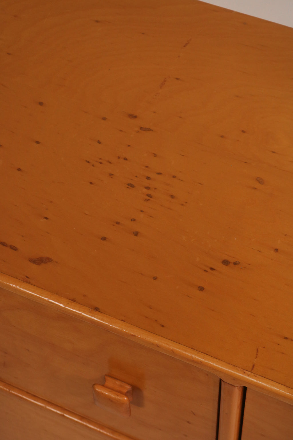 Close-up detail showing cosmetic marks and wear on the top surface