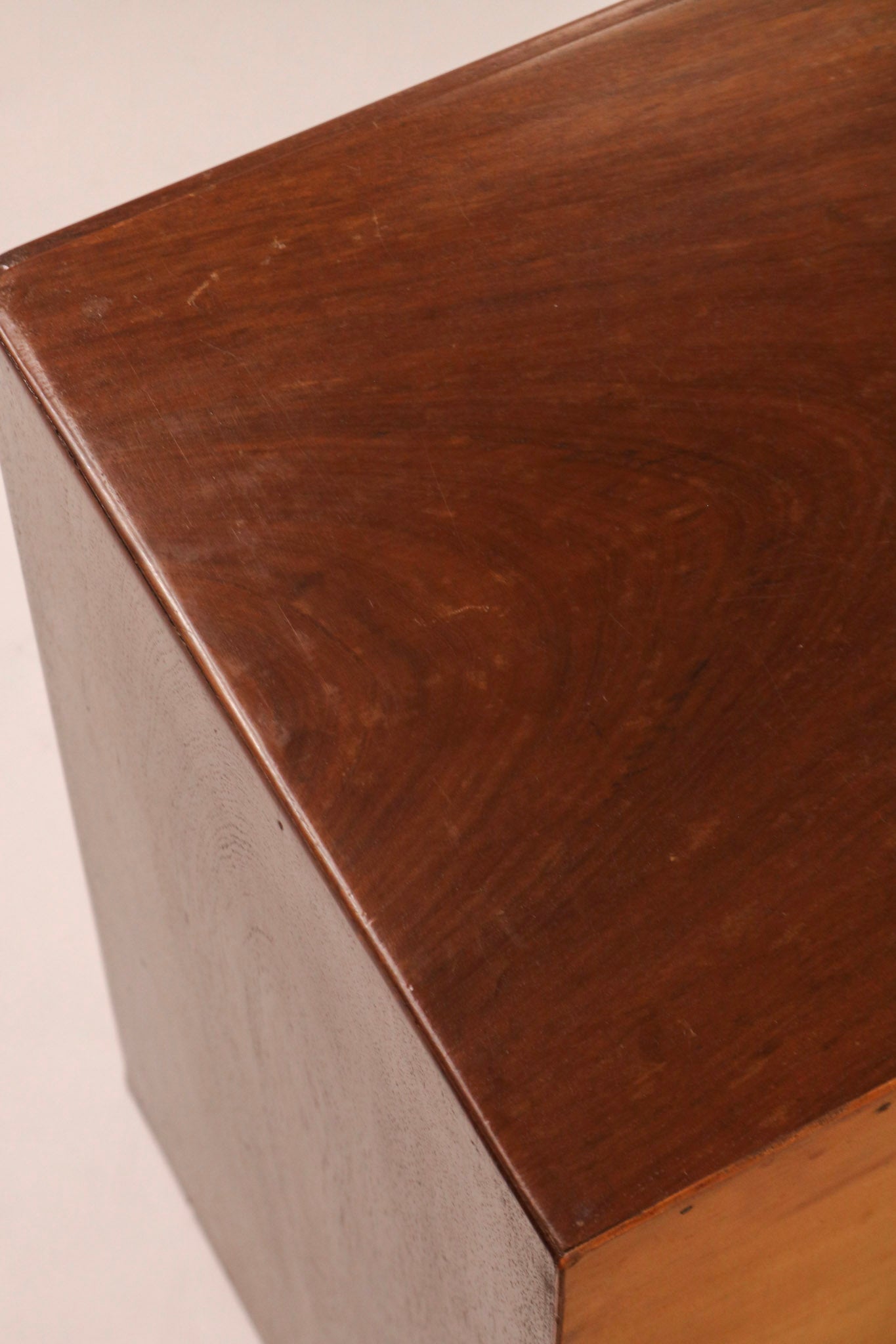 Detail of the top surface showing walnut finish and minor vintage wear