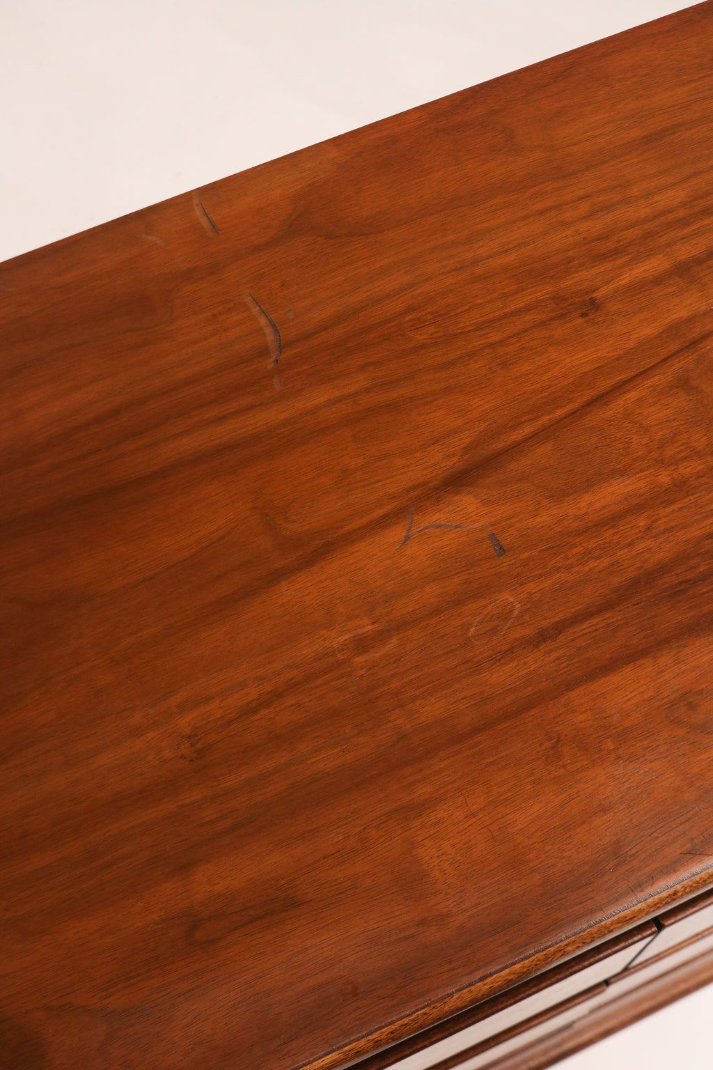 Close-up of top surface showing walnut grain and finish condition