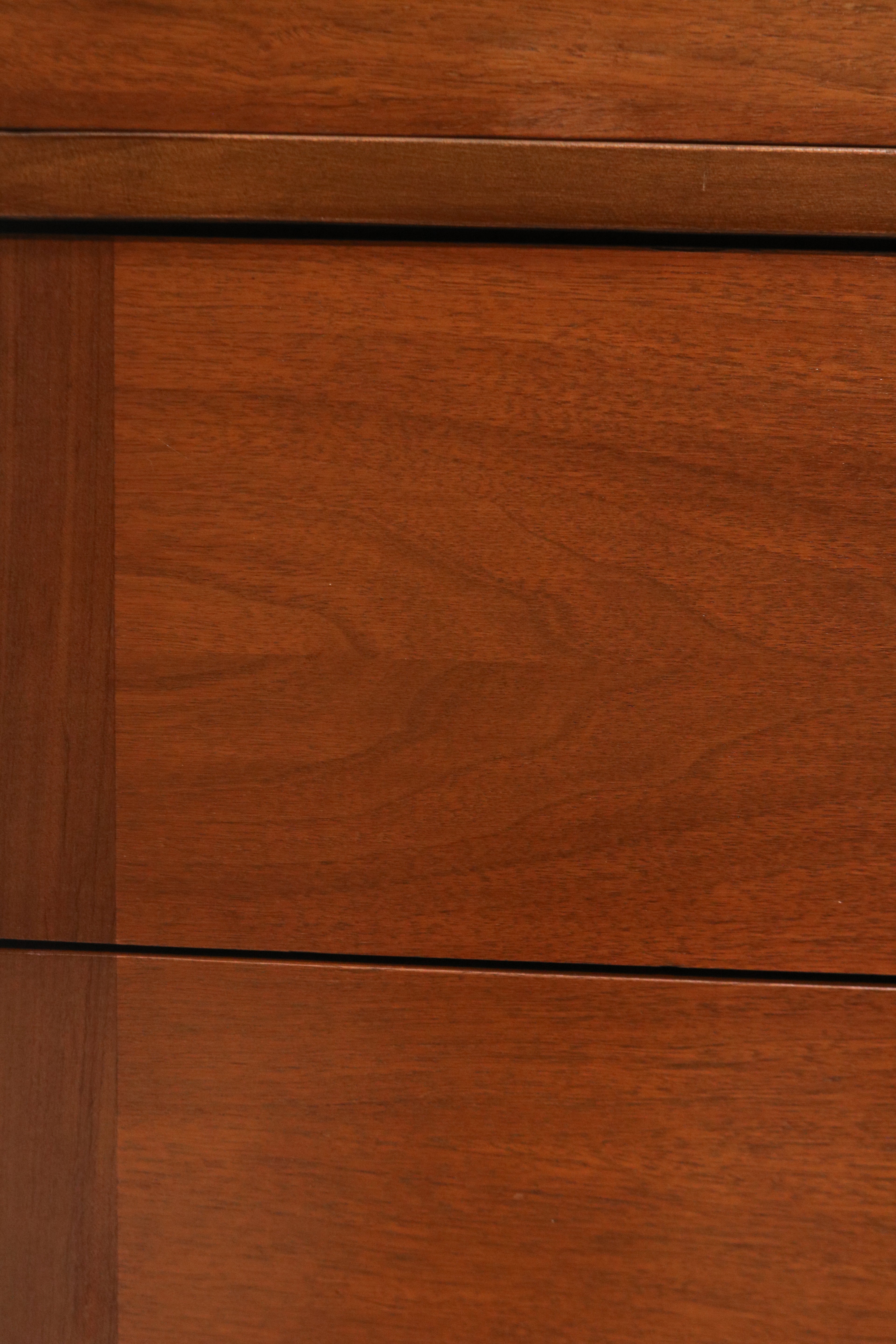 Close-up of top surface showing walnut wood grain and light marks mentioned