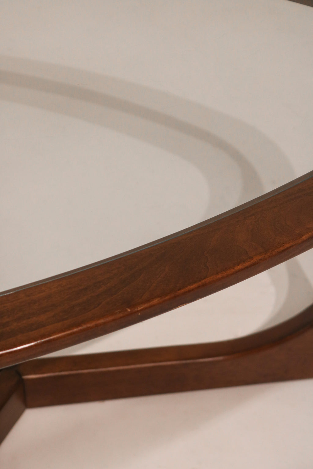 Top view looking through glass at the triangular wood base design