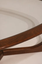 Top view looking through glass at the triangular wood base design