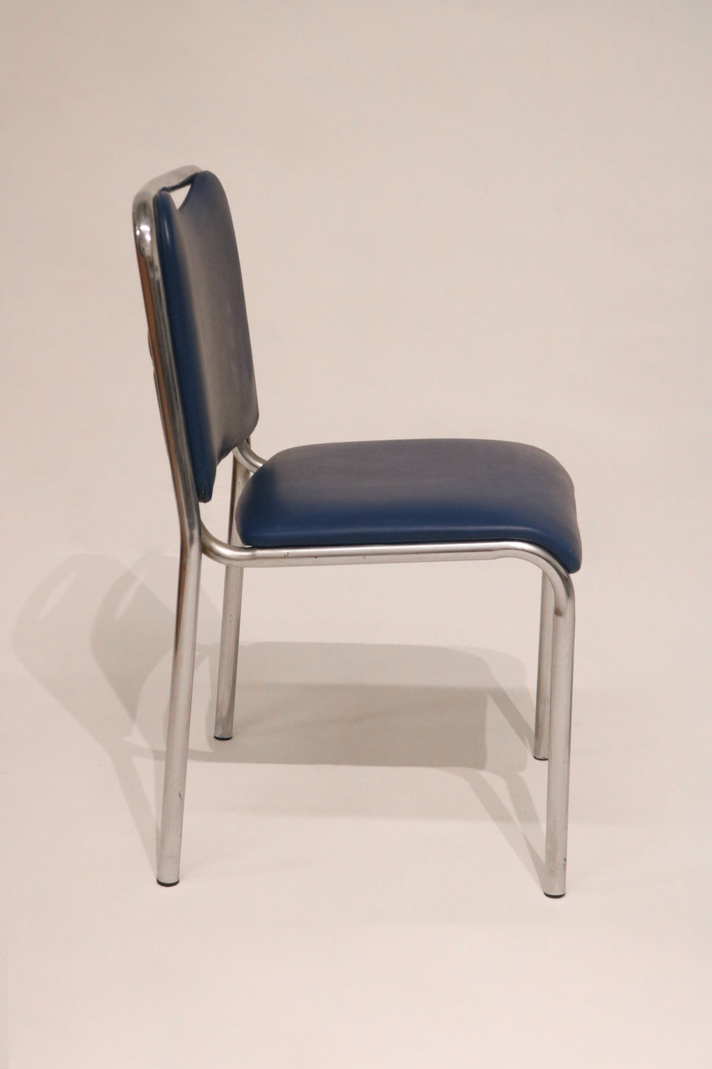 Detail of the smooth curve on the tubular steel backrest frame