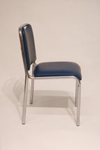 Detail of the smooth curve on the tubular steel backrest frame