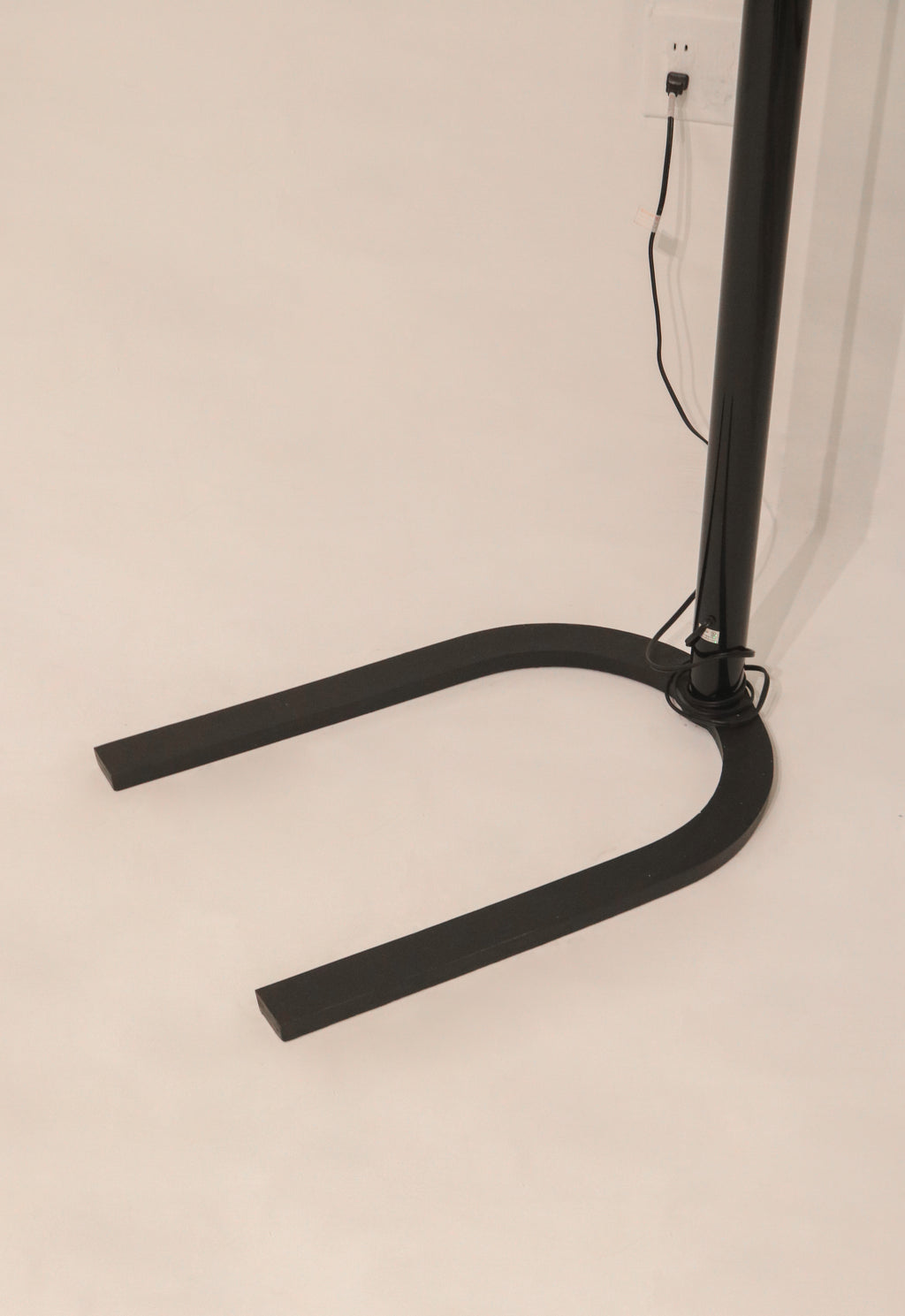 Close-up of the heavy U-shaped iron base providing stability