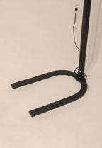 Close-up of the heavy U-shaped iron base providing stability