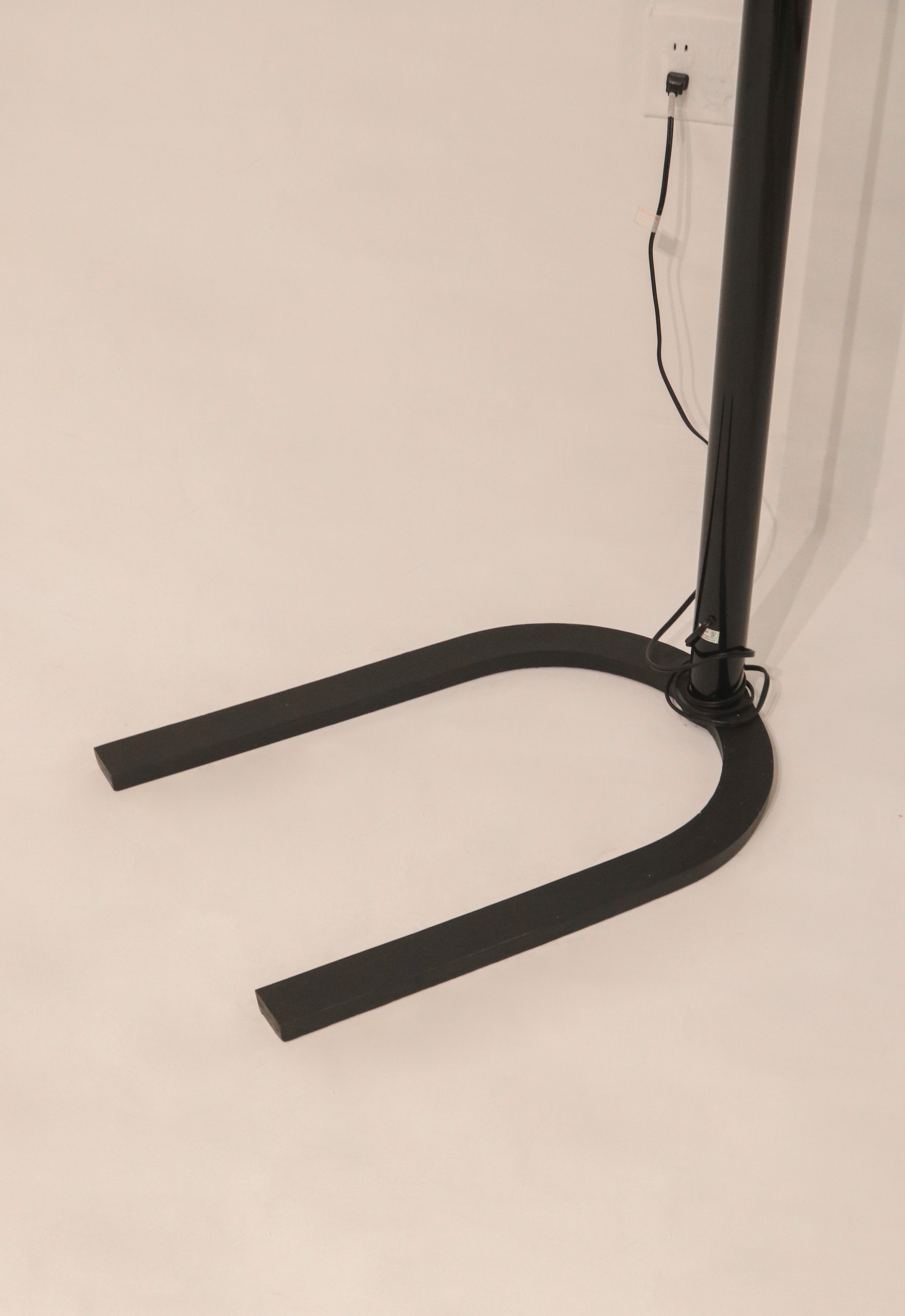 Close-up of the heavy U-shaped iron base providing stability