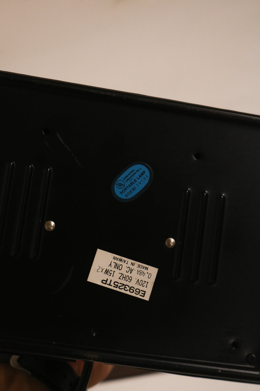 Underside view of the base showing label sticker and condition