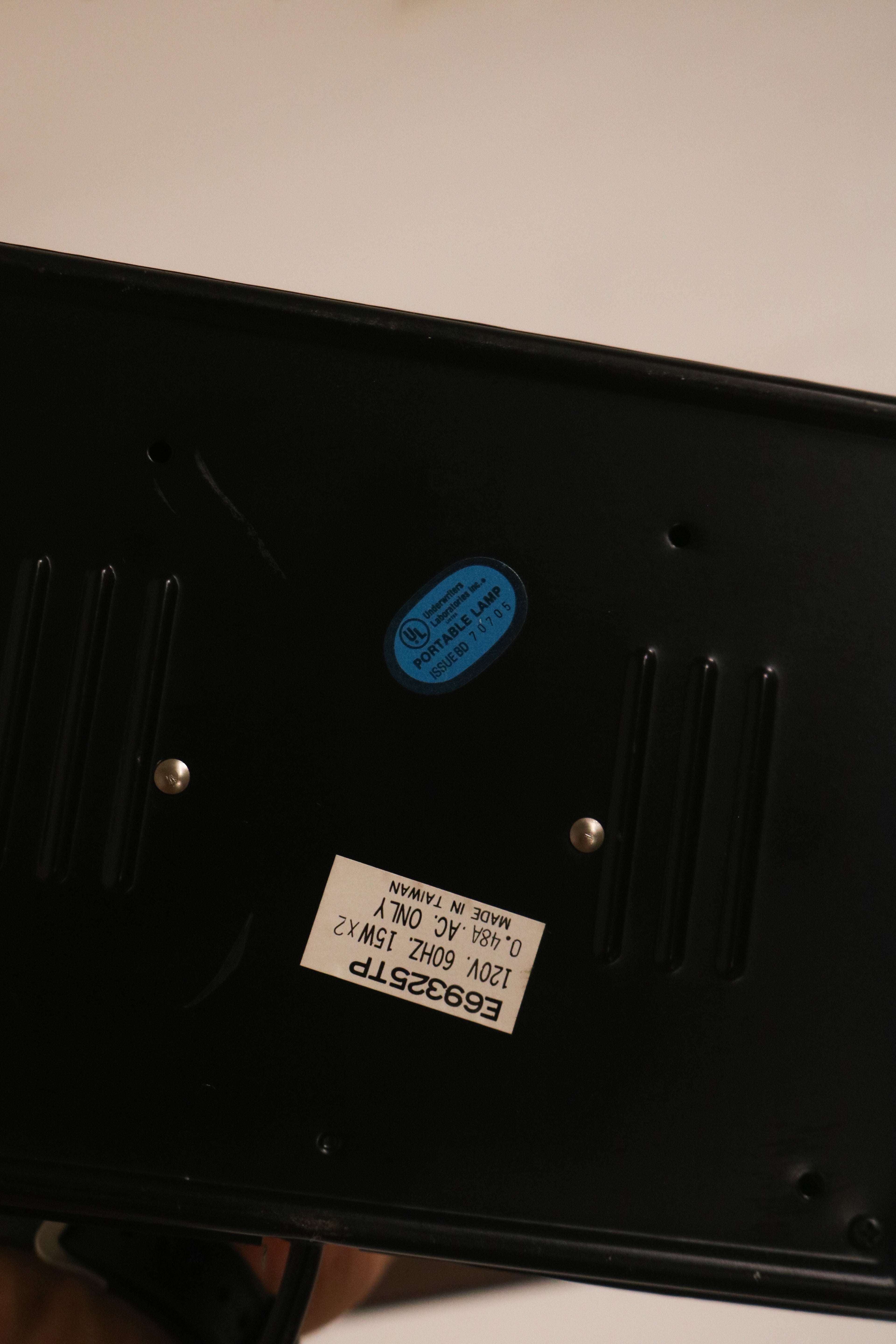 Underside view of the base showing label sticker and condition