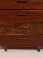 Front view of upper drawers showing rich walnut wood grain and matching finish
