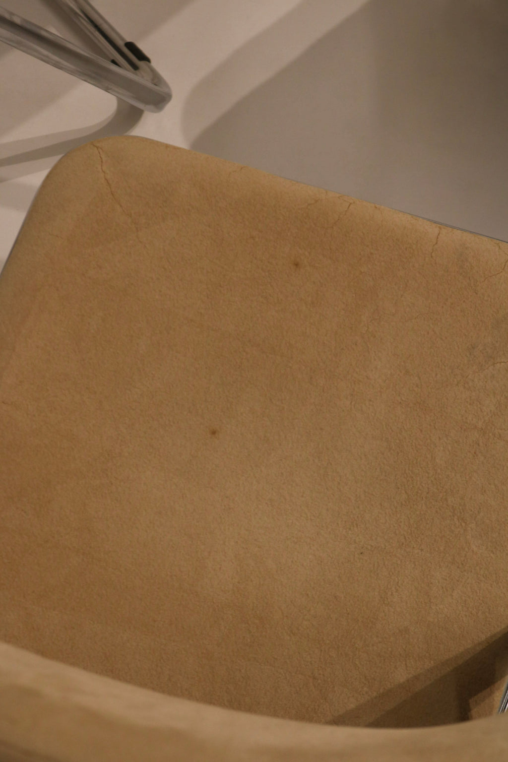 Close-up of velvet seat fabric texture showing vintage condition and wear