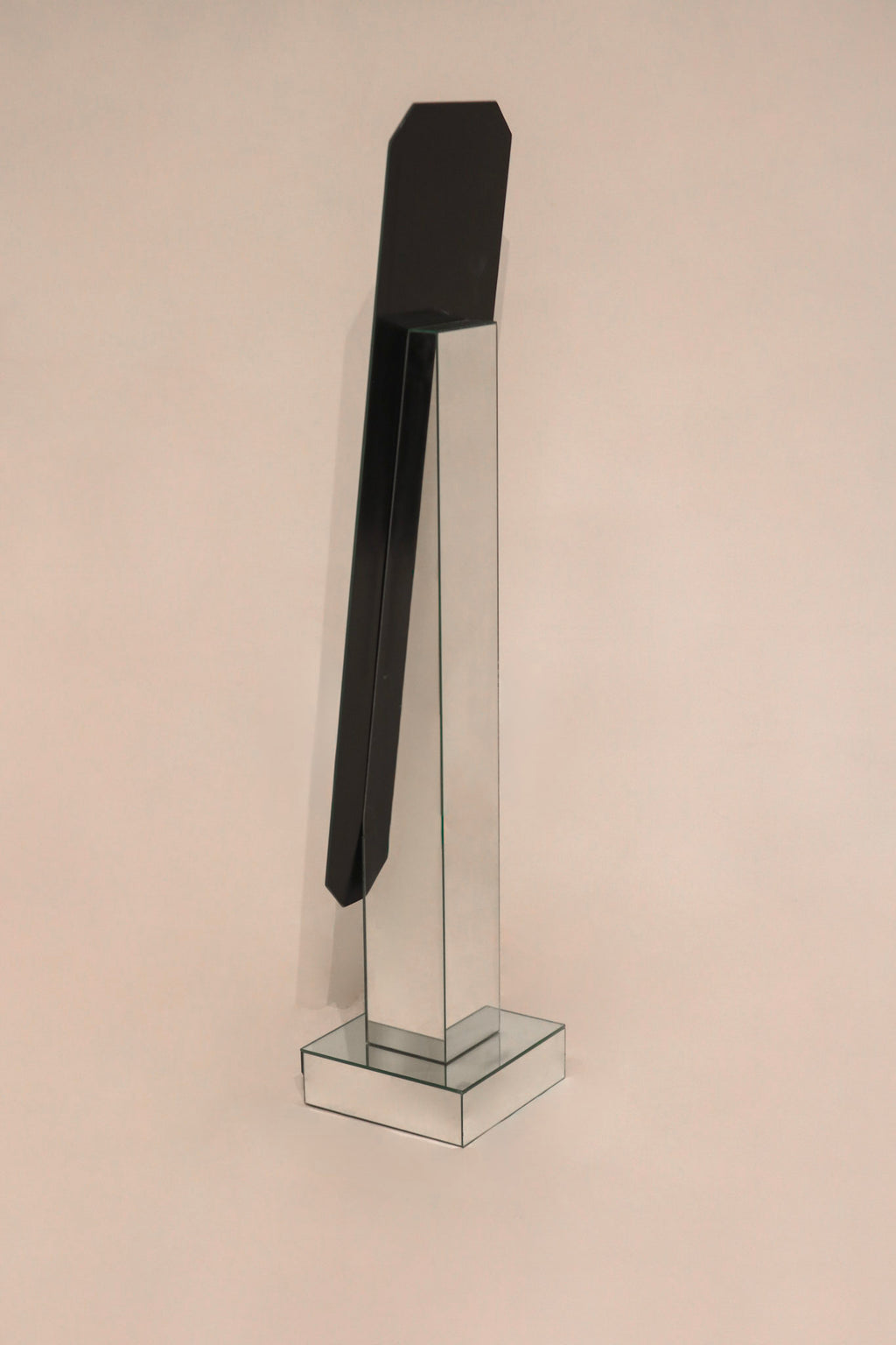 Base and stand detail of vintage postmodern full length mirror with minor wear