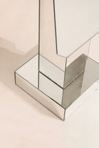 Upper section detail postmodern standing mirror showing geometric mirrored construction