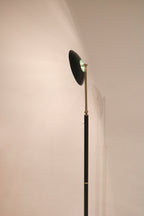 View of the lamp illuminated against a wall showing focused light