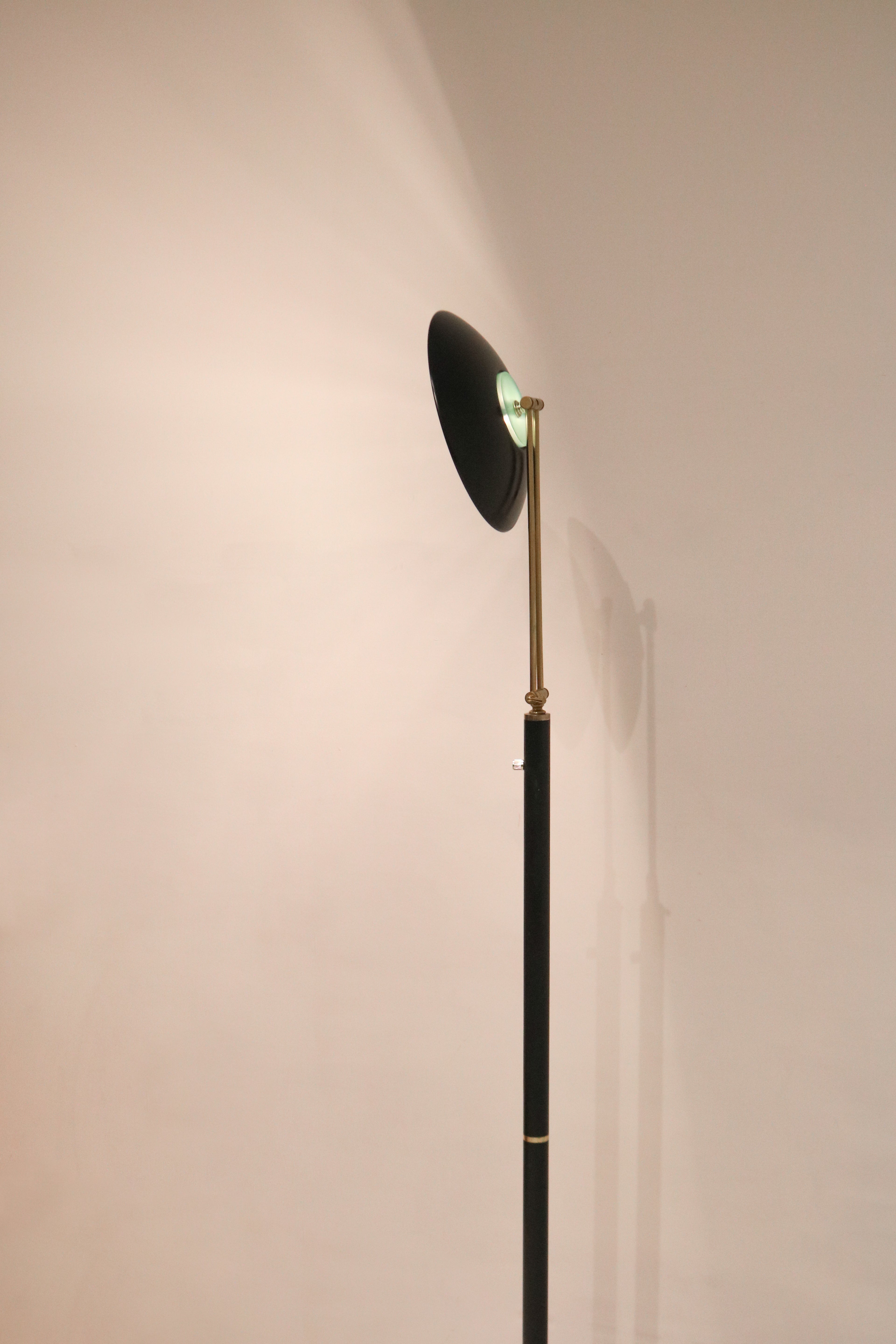 View of the lamp illuminated against a wall showing focused light