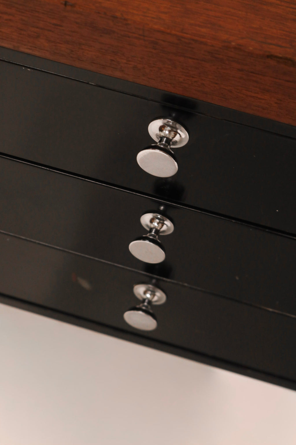Detail of water marks and wear on the solid walnut top surface