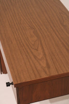 Close-up of walnut veneer desktop grain pattern and finish
