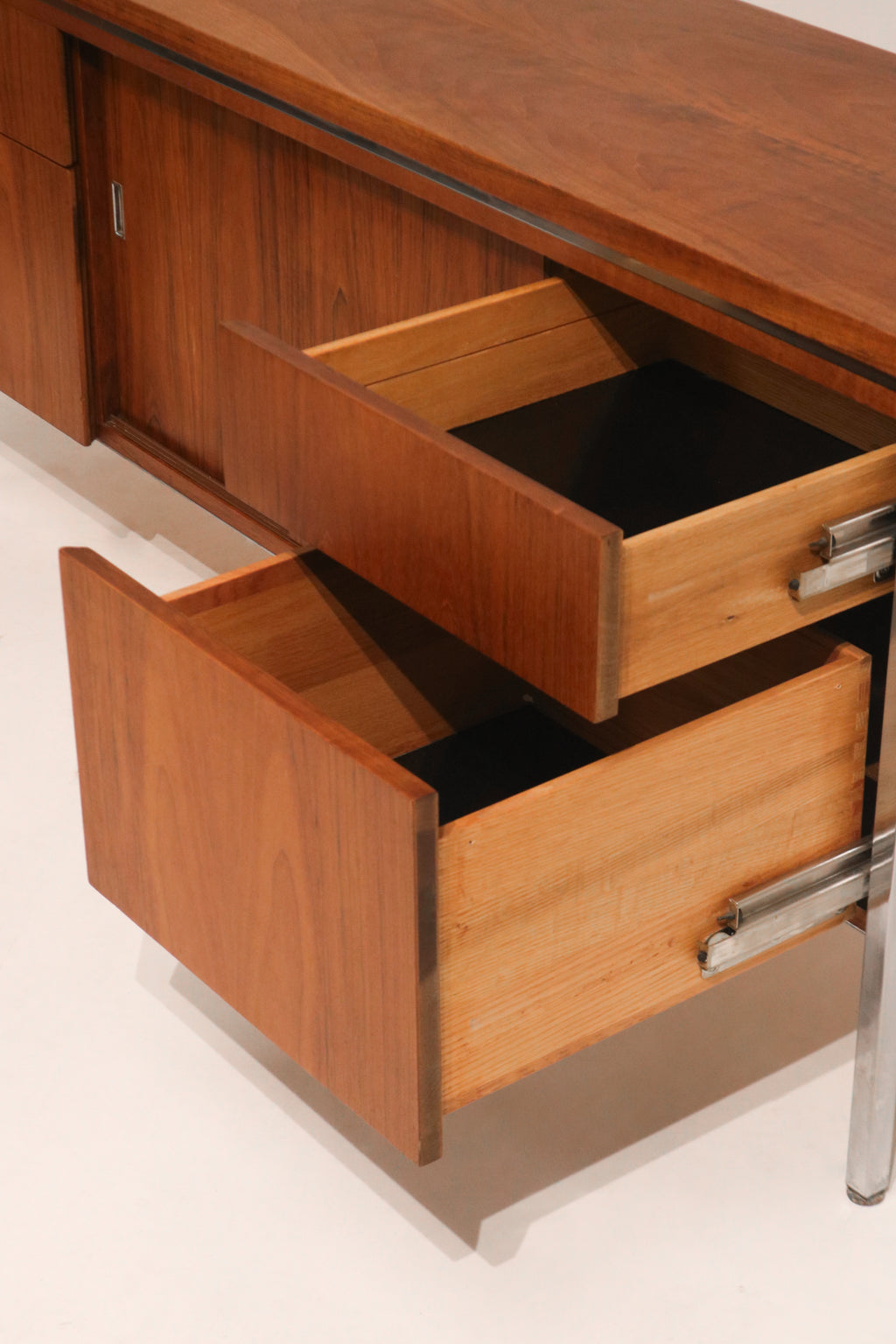 Macro shot of the walnut veneer showing rich color and grain