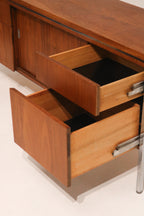 Macro shot of the walnut veneer showing rich color and grain