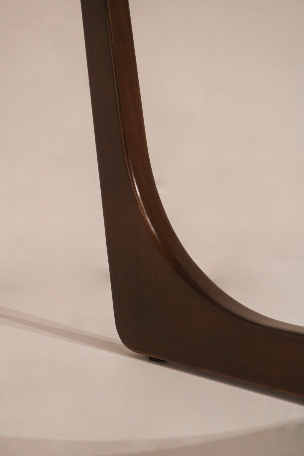 Close-up of the walnut wood finish and grain texture on the frame