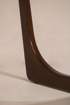 Close-up of the walnut wood finish and grain texture on the frame
