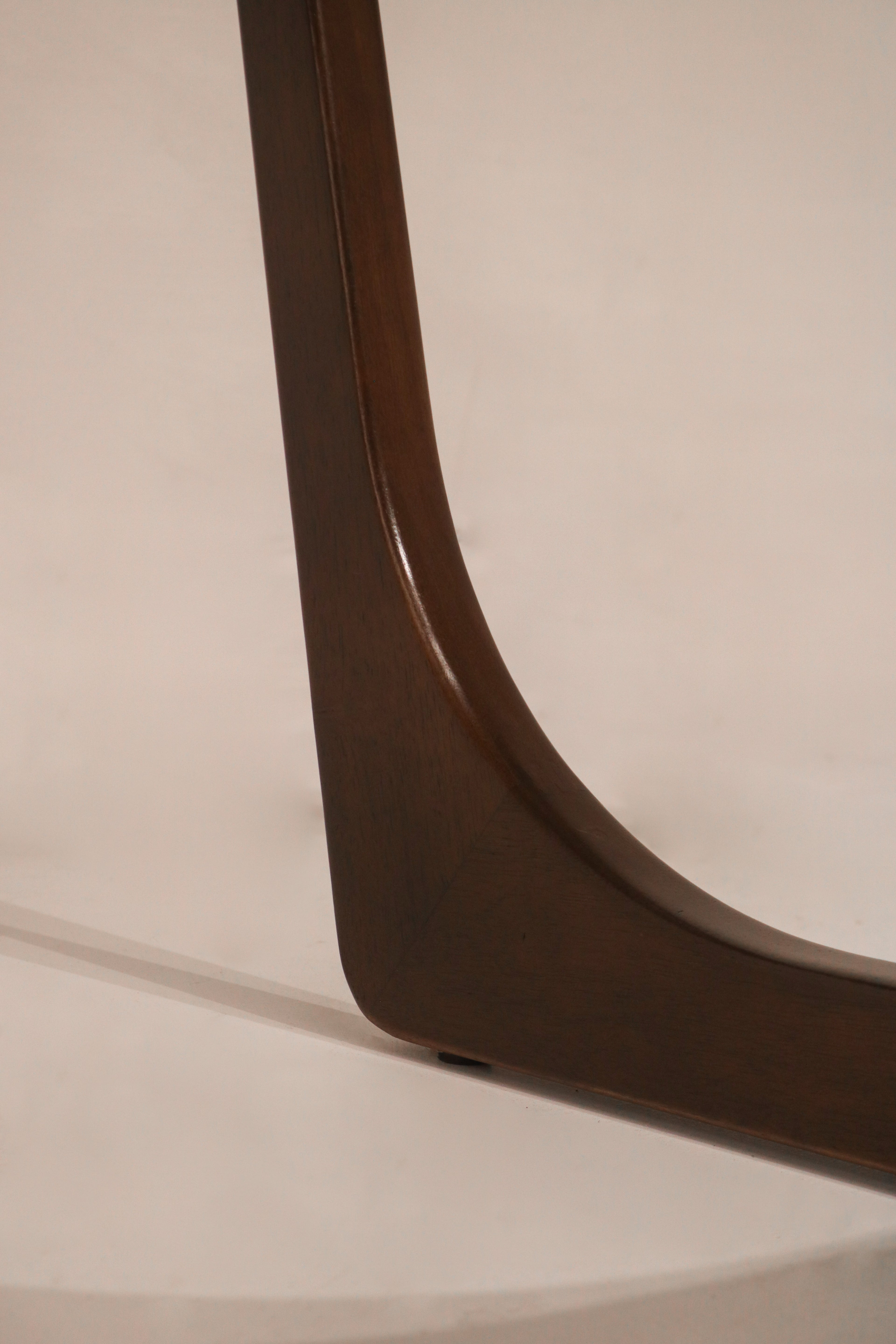 Close-up of the walnut wood finish and grain texture on the frame