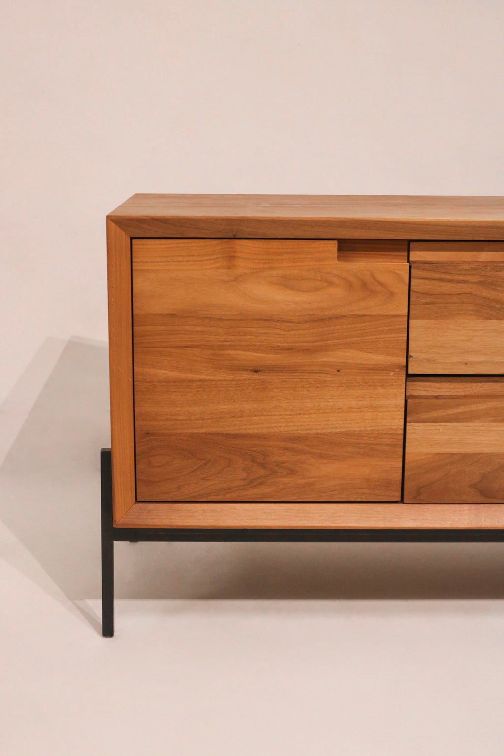 Close-up of the solid walnut wood grain on the front door panel