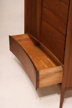Detail of the wood joinery and craftsmanship on the curved front