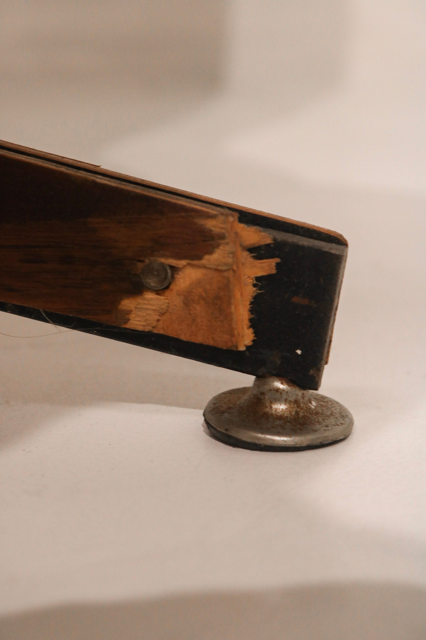 Detail showing finish wear mark on the wood shell surface